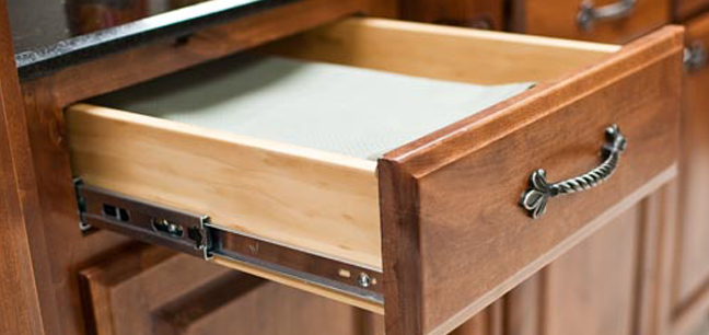 A close up of an open drawer with the lid down