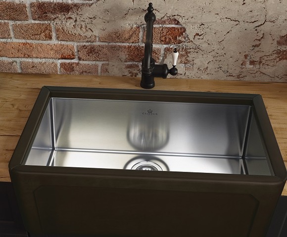 A sink with a metal bowl on top of it.