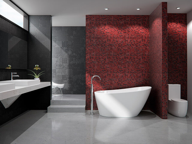 A bathroom with red tile and white fixtures.